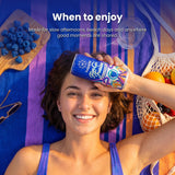 Woman relaxing on a beach towel with a can of Happie Fungi Fusion Blue Raspberry