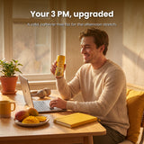 Man at a sunny desk enjoying a can of Happie Fungi Fusion Mango Mimosa in the afternoon